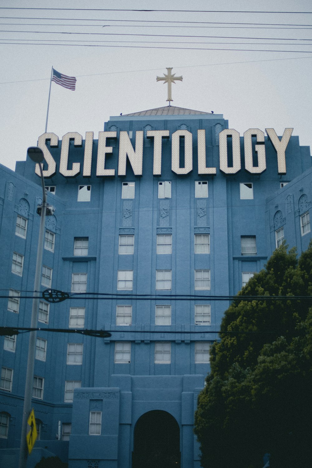 a blue building with a sign that says scientology