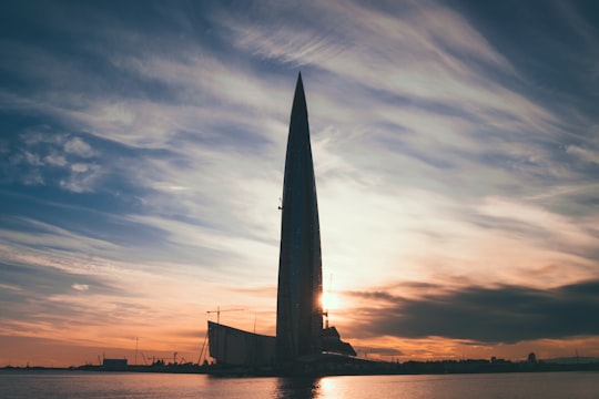 silhouette of high-rise building during golden hour in Park 300-Letiya Sankt-Peterburga Russia