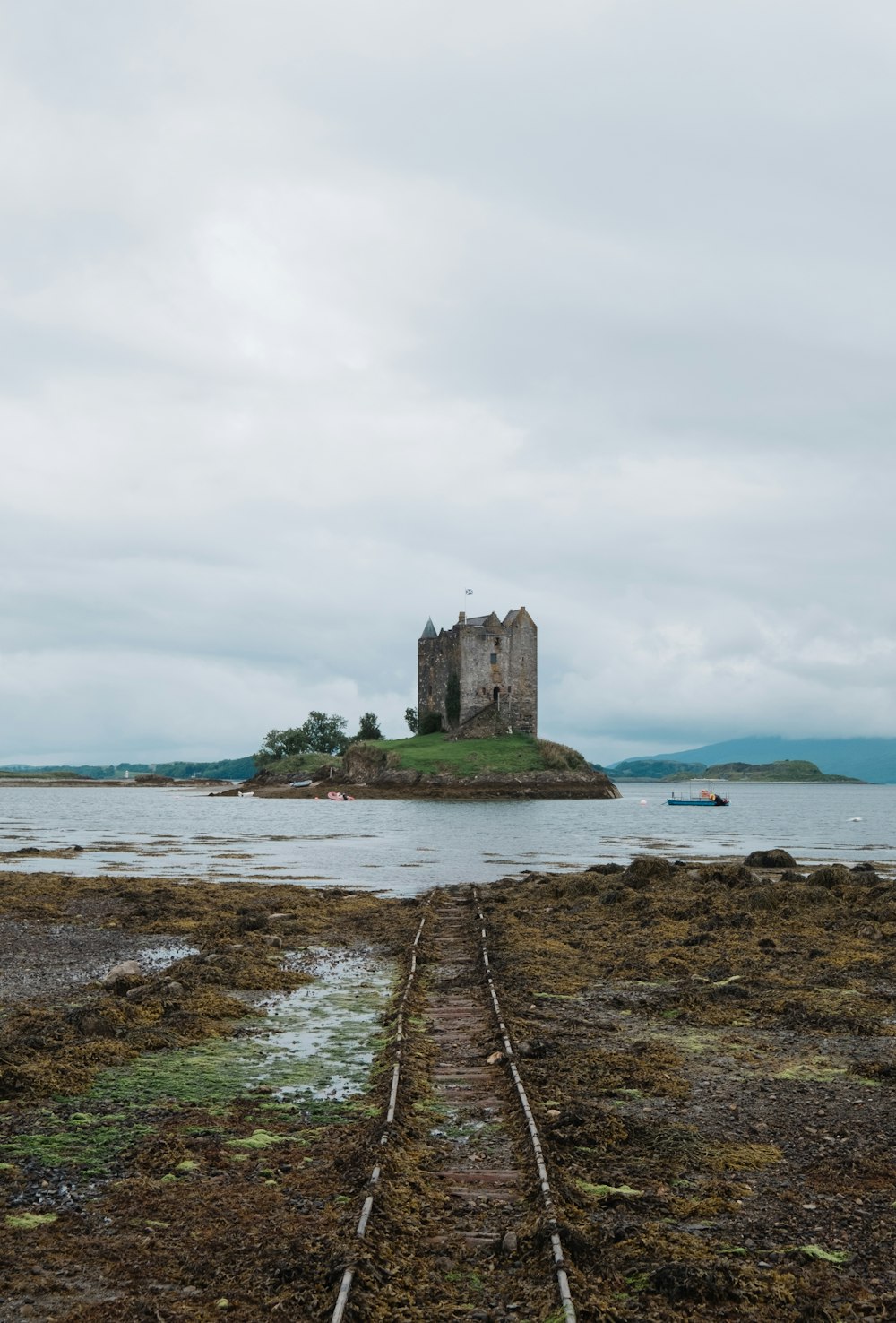 a castle sitting on top of a small island