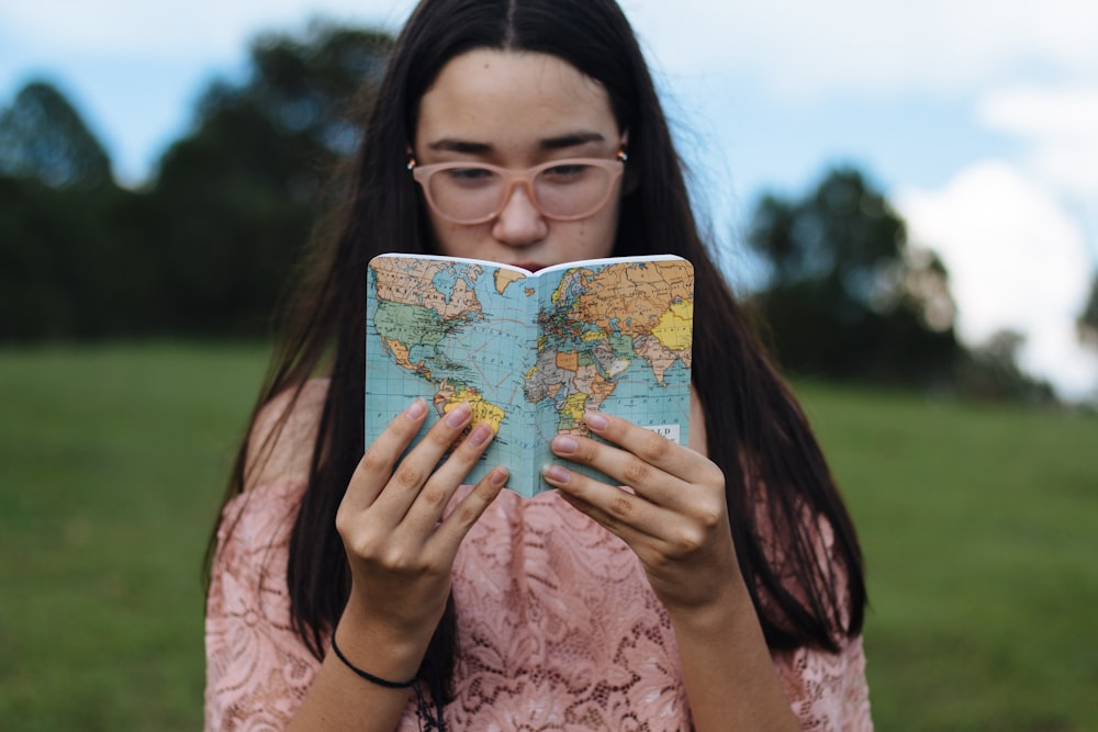 woman holding political map