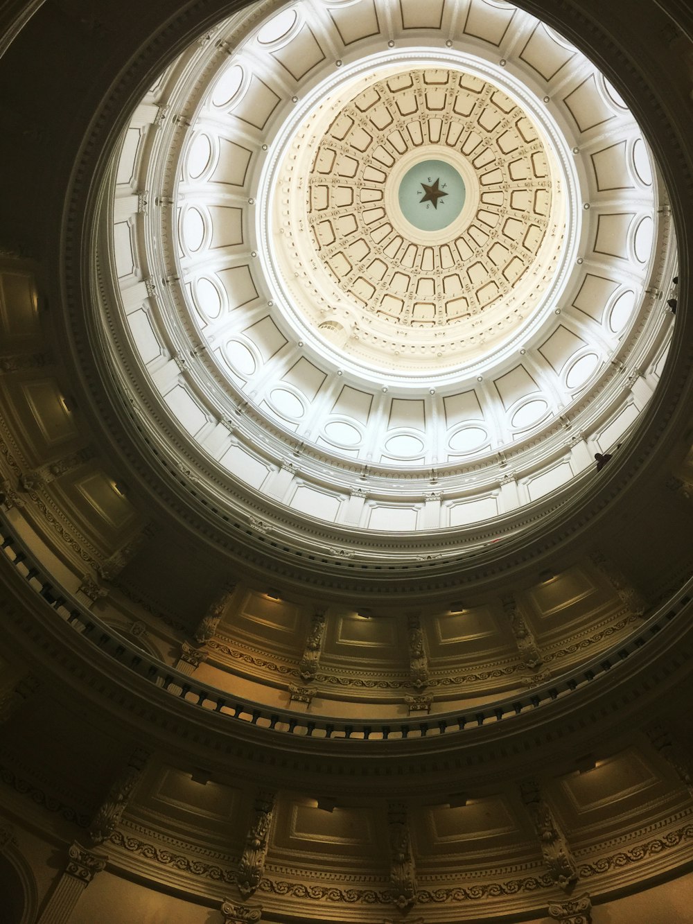 low angle photo of white and brown painted ceiling