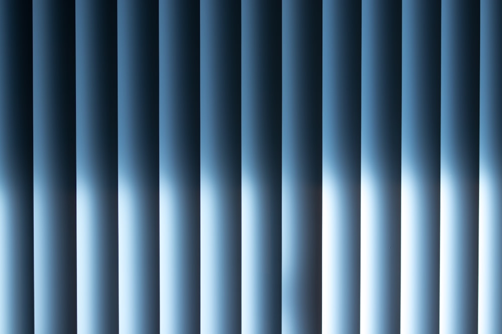 a black and white photo of a blue curtain