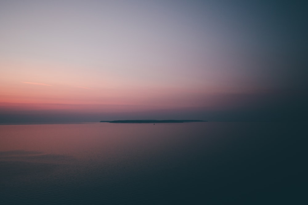 calm body of water during nighttime