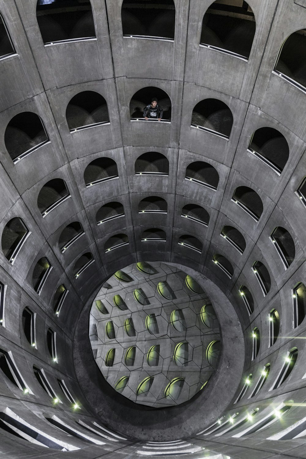 the inside of a building with a circular hole in the center