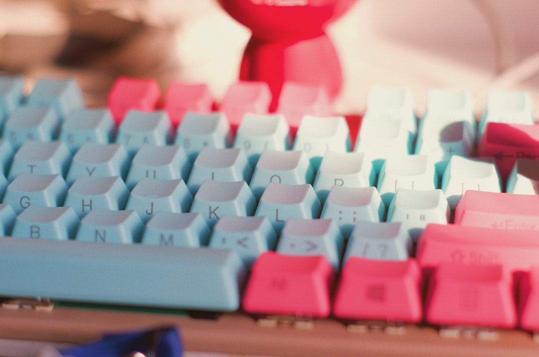 blue and pink computer keyboard