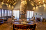 A luxury interior featuring a statement cattle skull piece mounted above a modern fireplace.