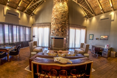 Spacious open-plan living room with rustic decor.