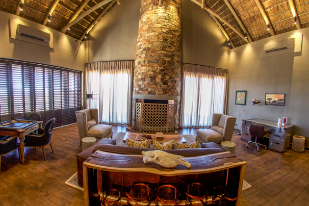 Spacious living room inside a kuxa'an apartment featuring cozy seating and vibrant textiles.
