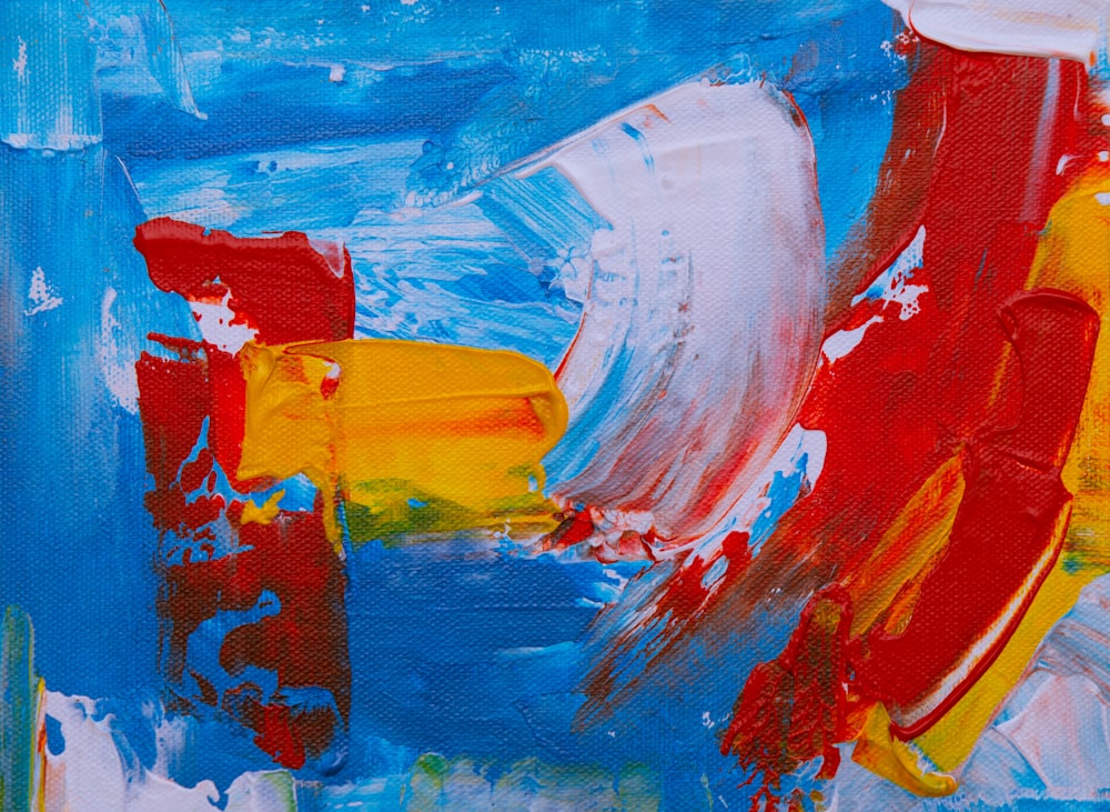 blue, yellow, white, and red paint stroke