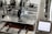 A 3D printer in operation, with a close-up view of the printing head moving over the print bed. The printer's mechanical components and electronic controls are visible, emphasizing precision and technology.