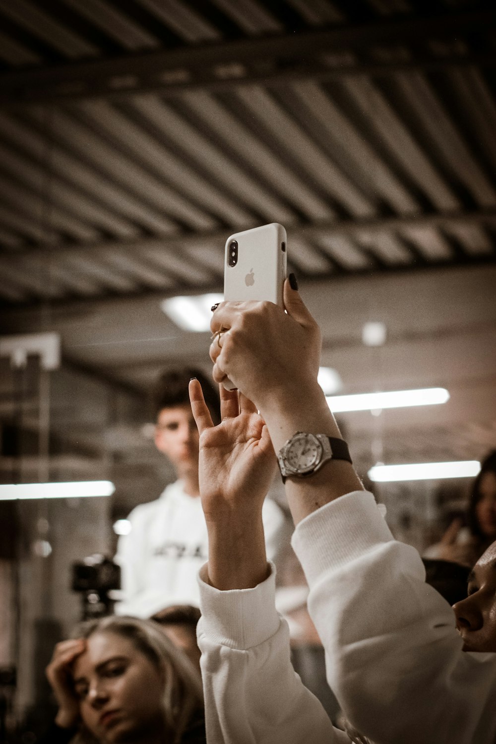 person holding silver iPhone X