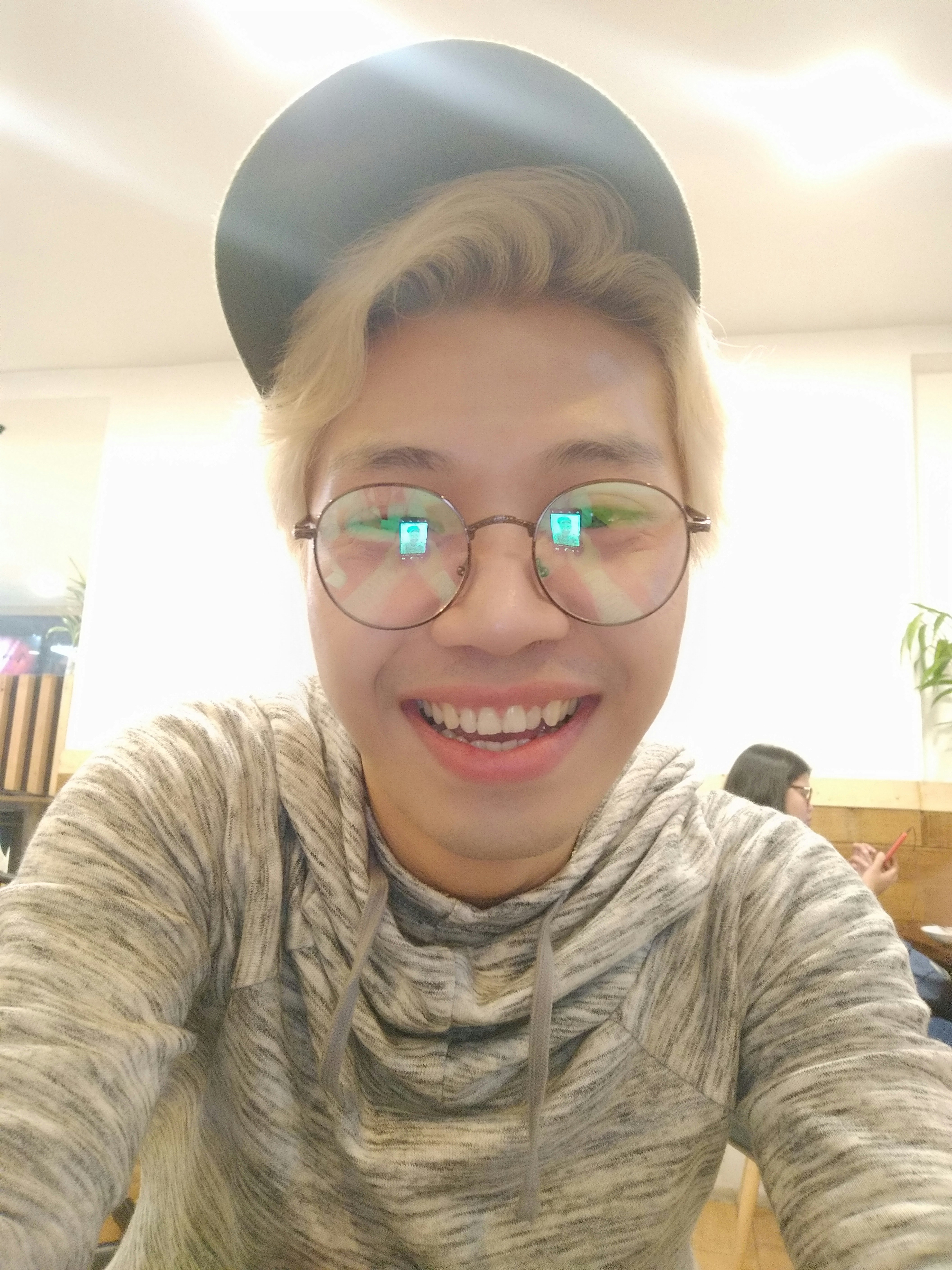 Young man with glasses and enthusiastic expression as anime fan