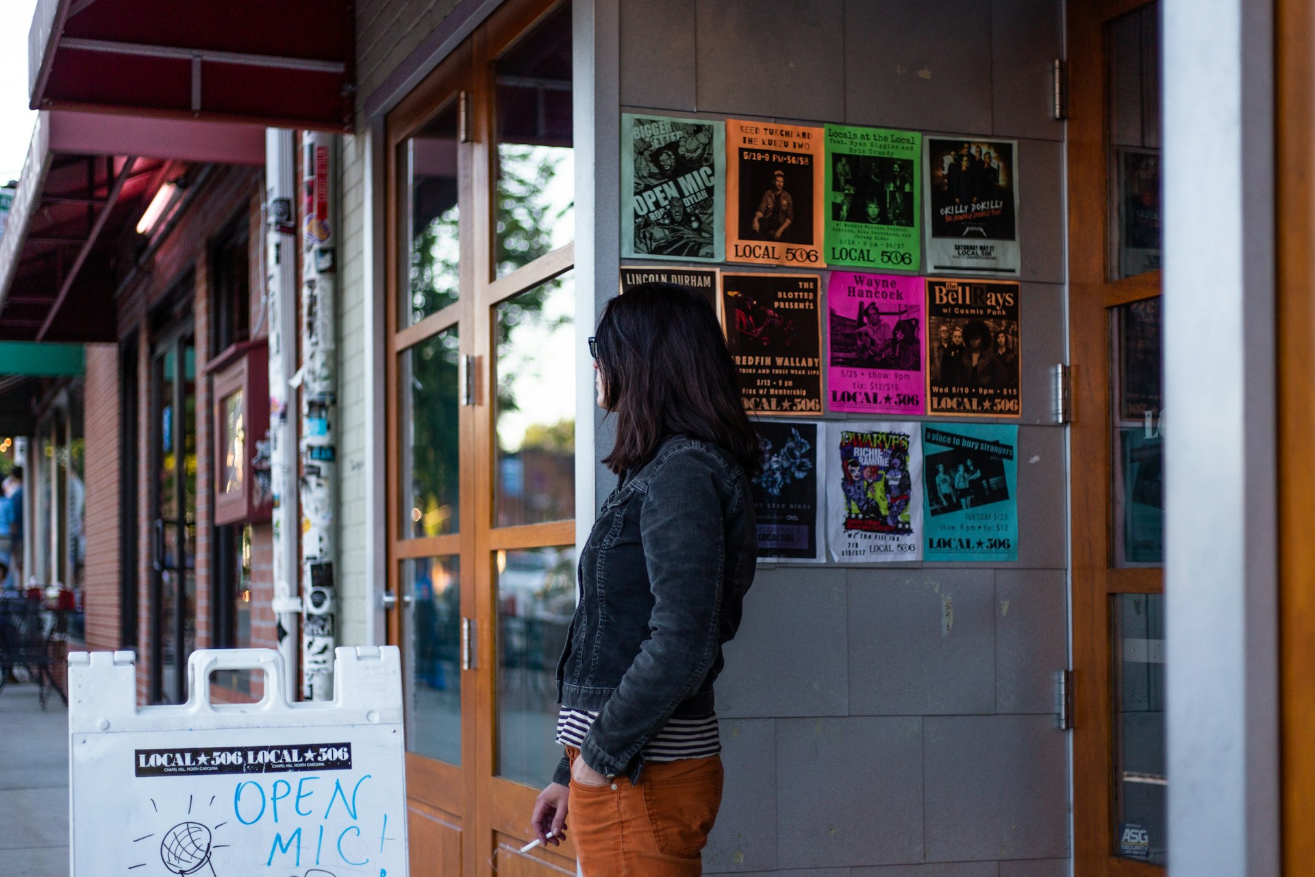 woman wearing yellow long-sleeved dress under white clouds and blue sky during daytime