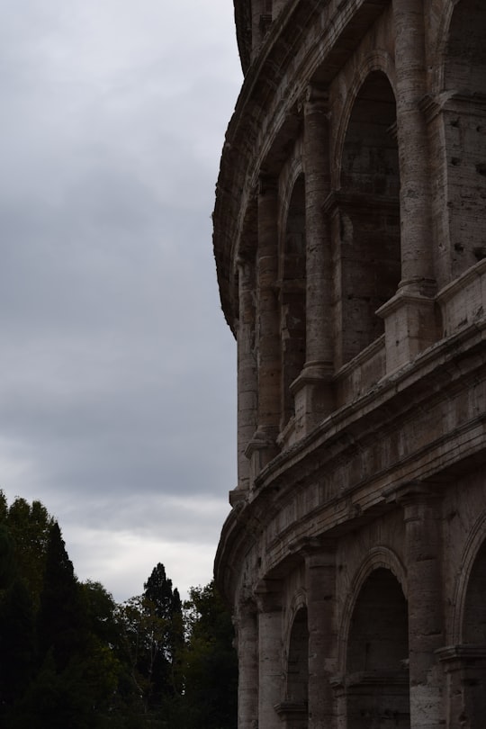 building near trees during day in Colosseum Italy
