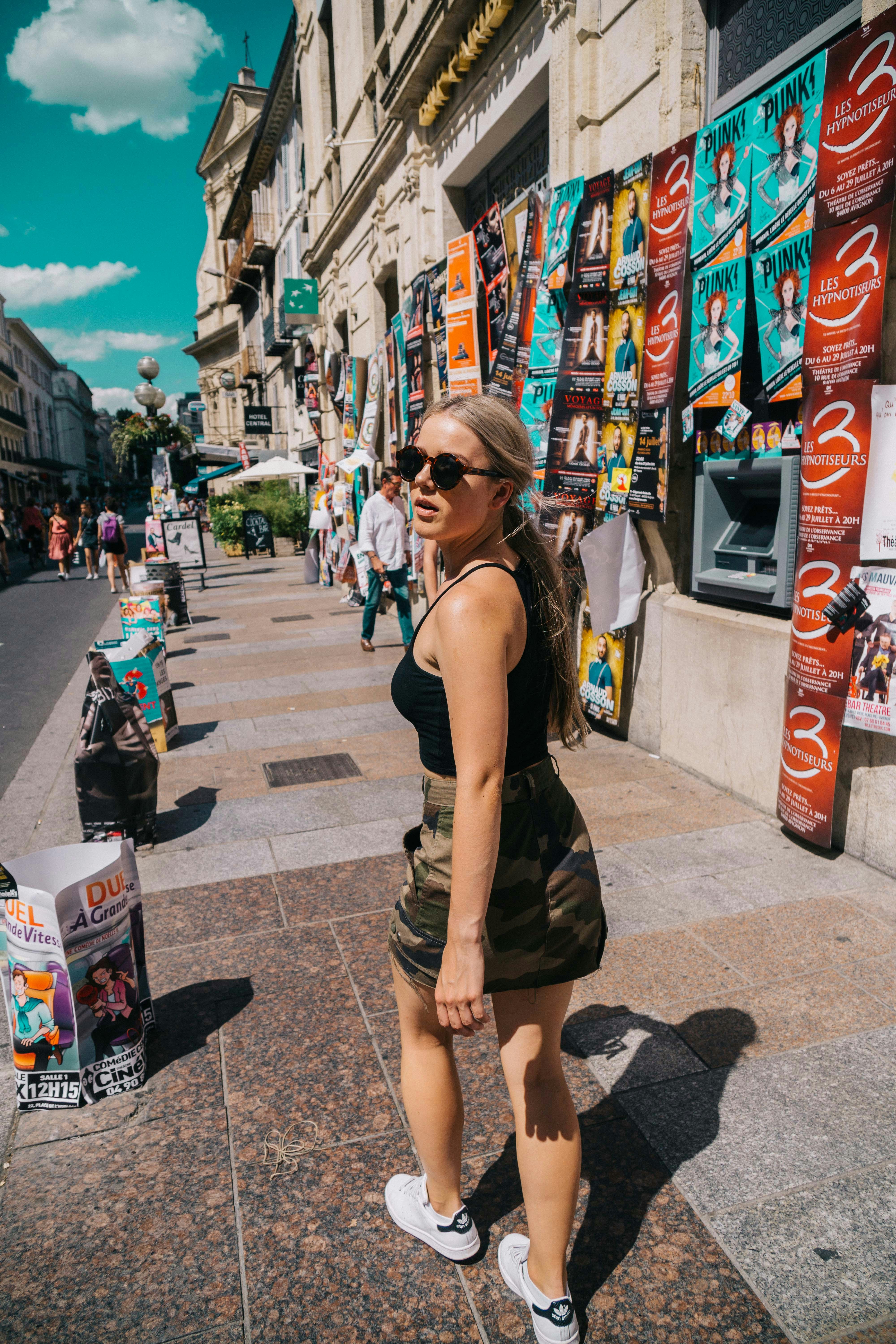 woman walking in sidewalk