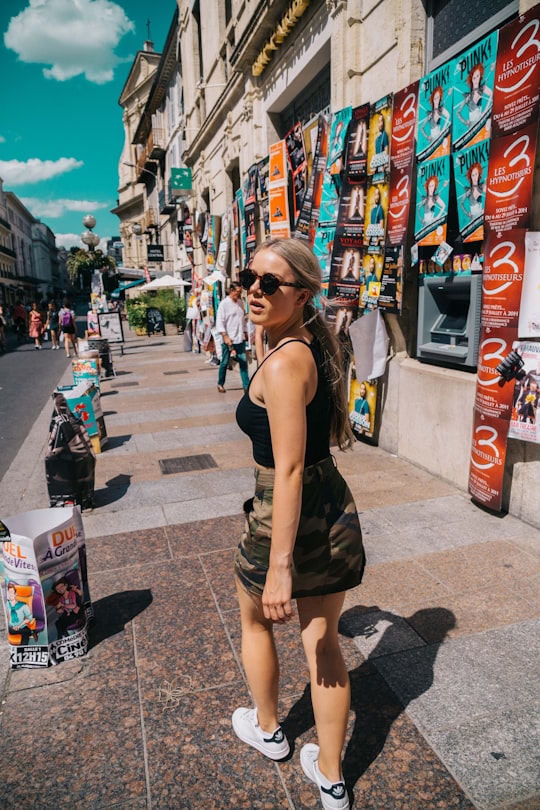 woman walking in sidewalk in Avignon France