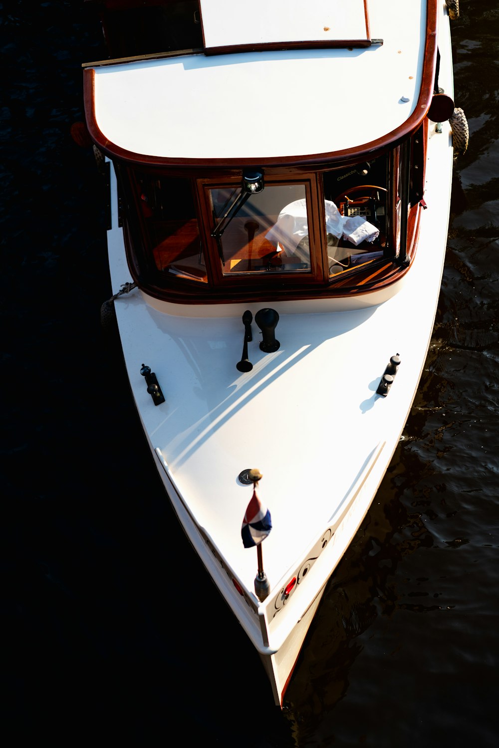 white yacht on body of water