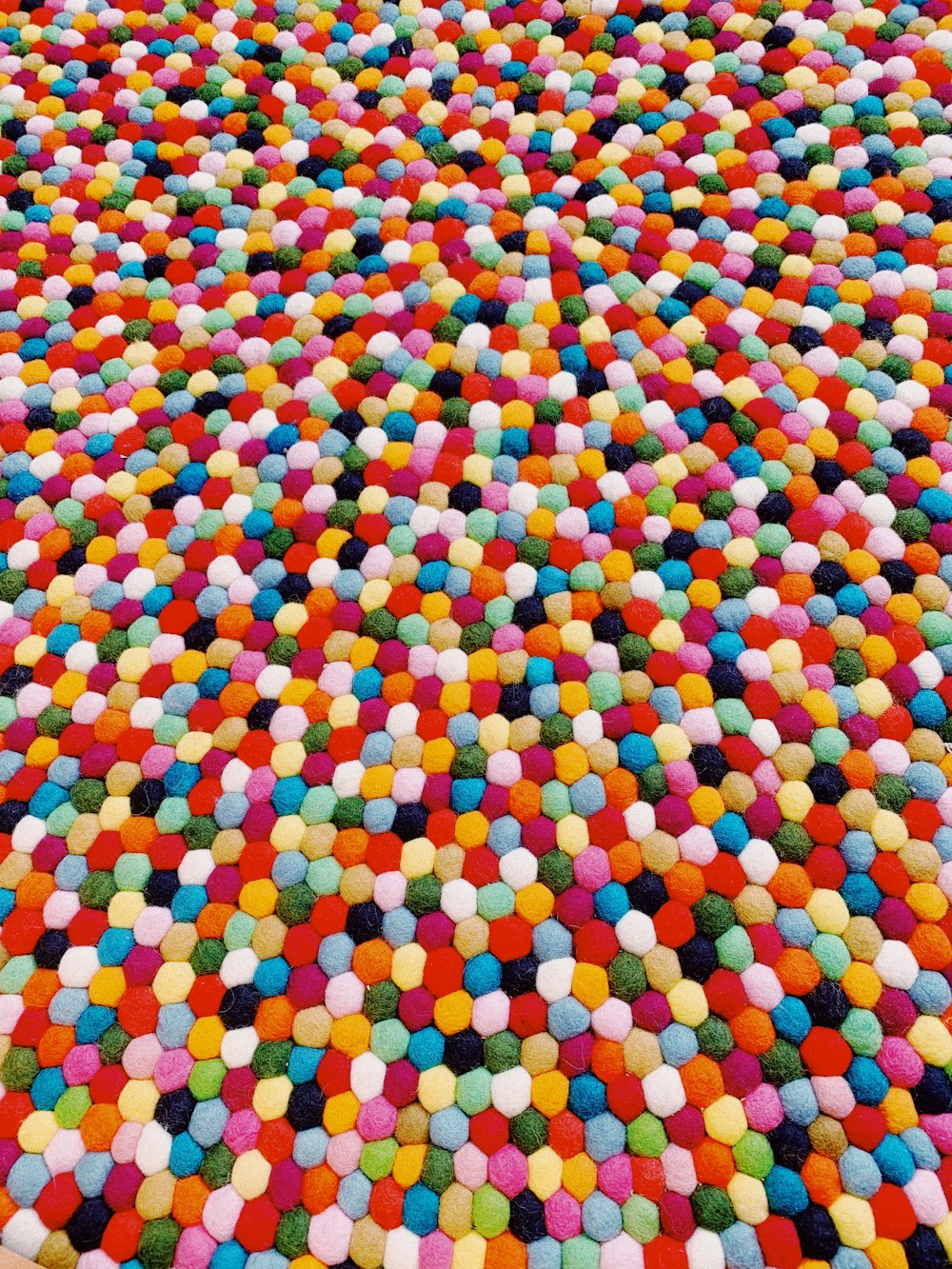 a multicolored area rug with a pattern of circles