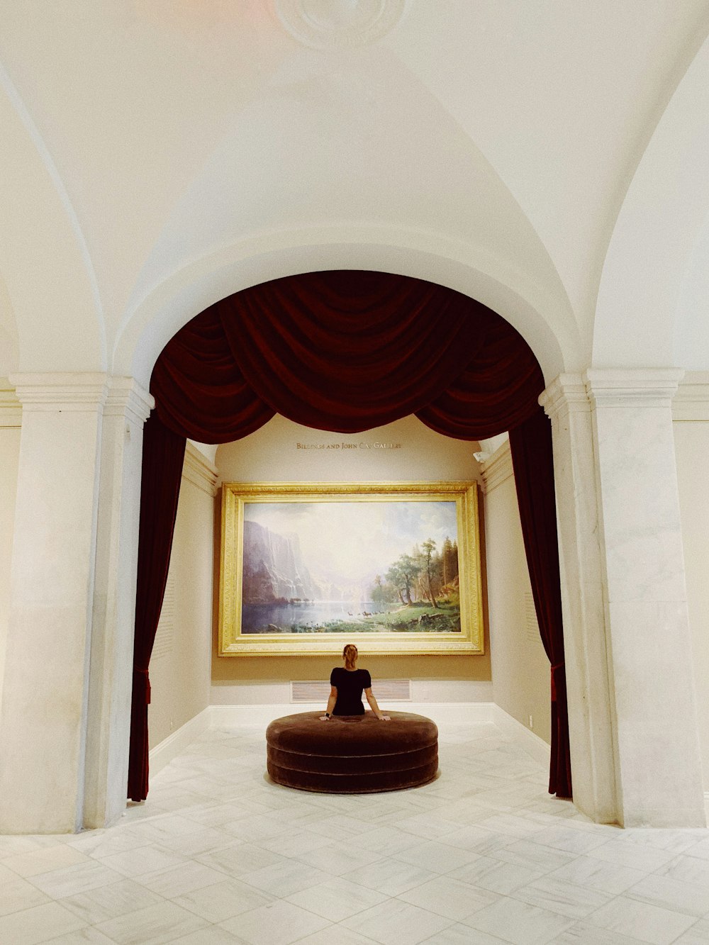 woman sitting on brown sofa