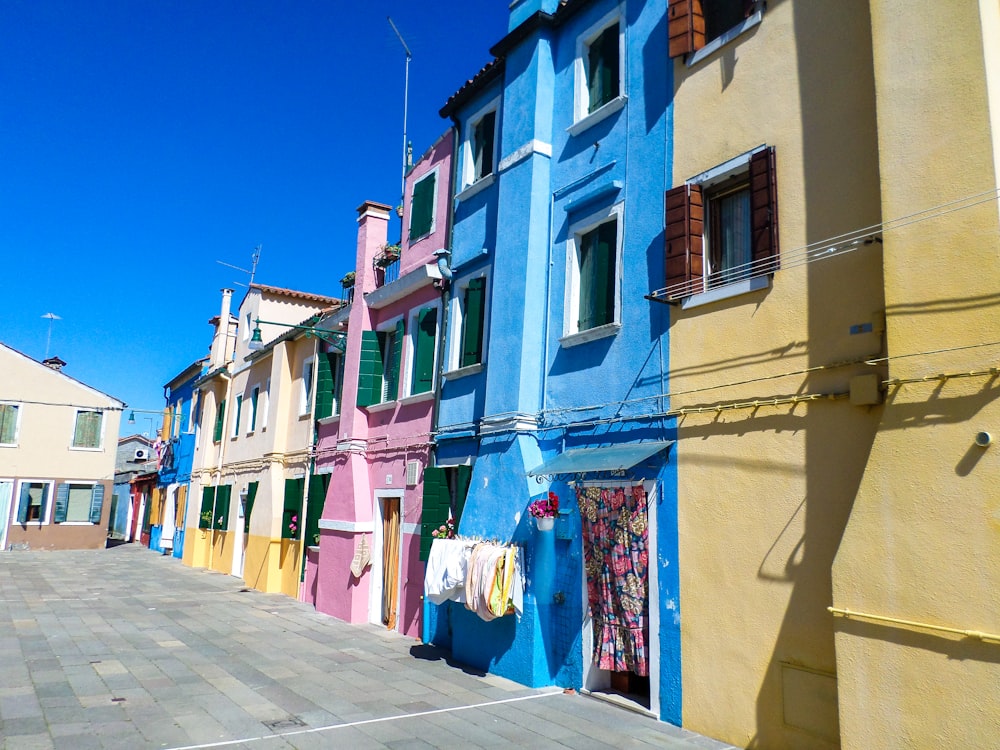 assorted-color houses under blue sky