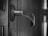 Close-up of a sturdy steel door with a modern handle in a residential setting.