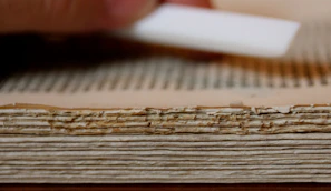 Expert restoring an old document with delicate tools.