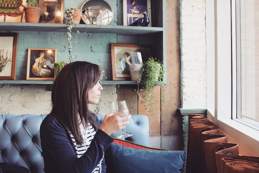 woman holding wine glass