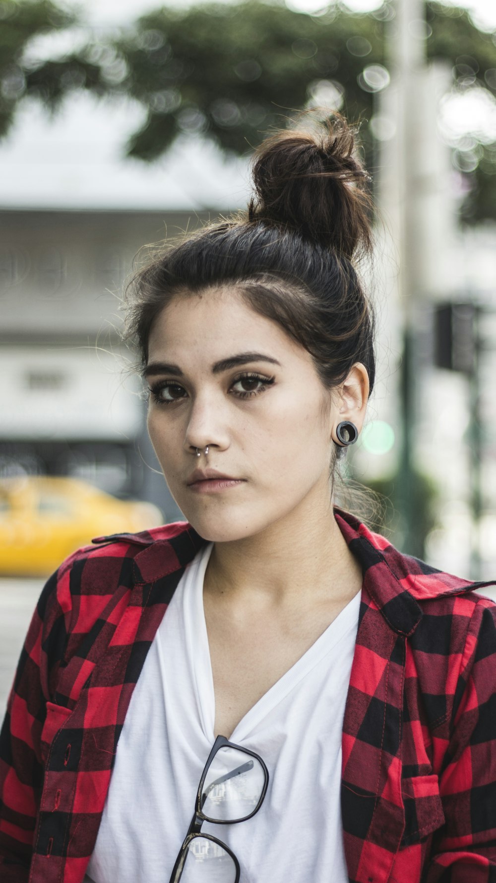 selective focus shot of woman in white top standing