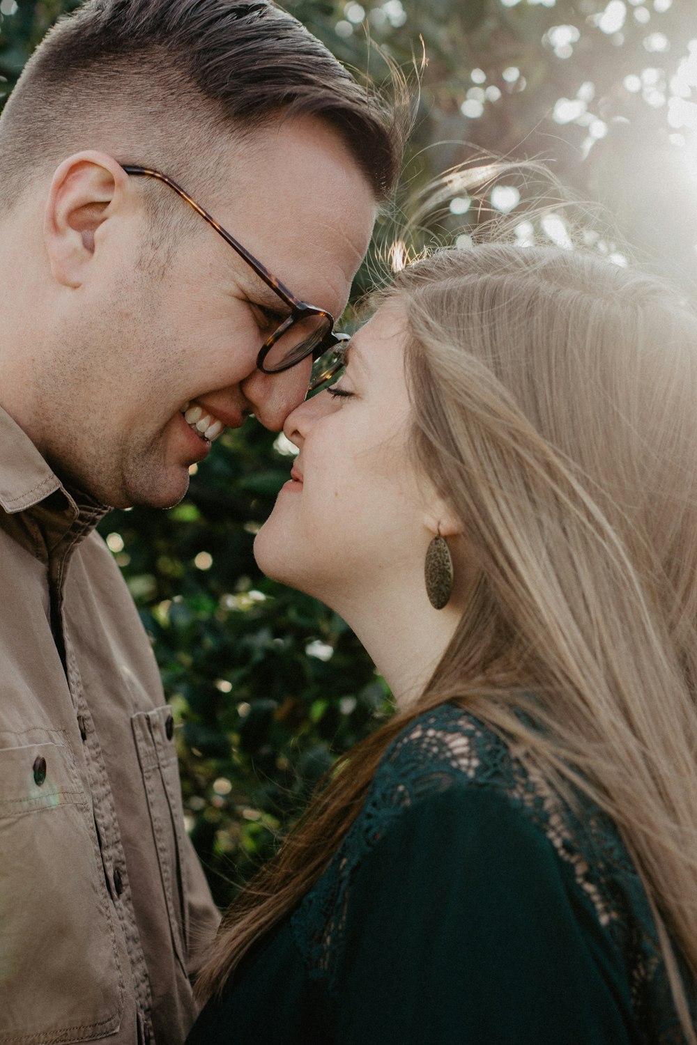 man and woman smiling each other during daytime