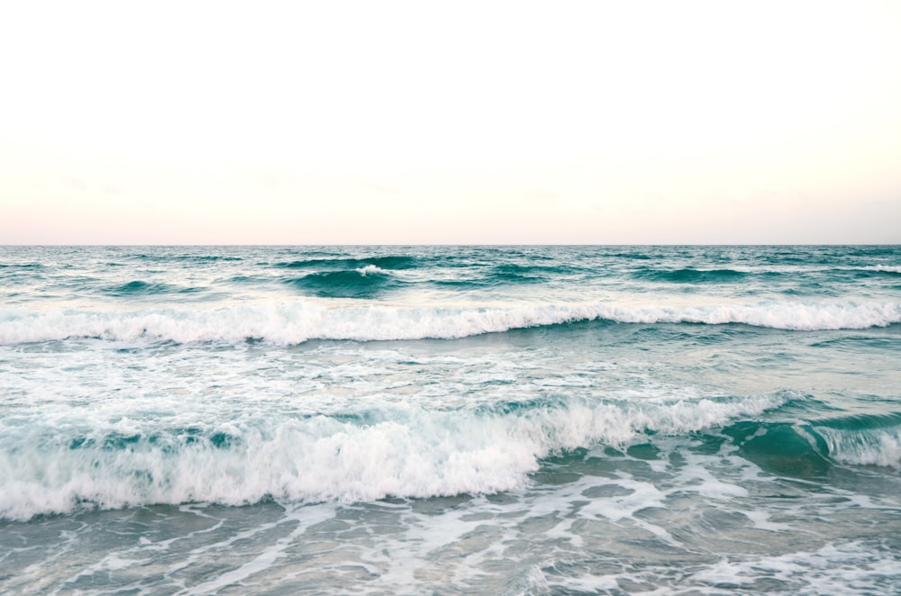 sea waves under clear sky during daytime