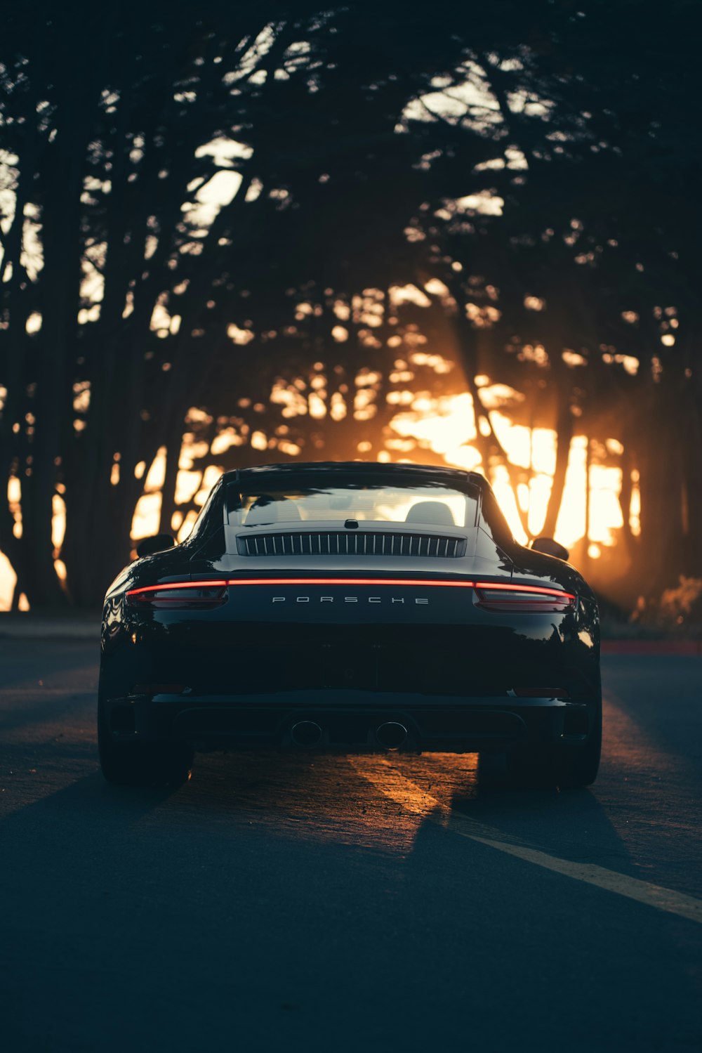 parked black vehicle during golden hour