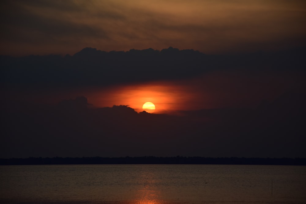 sunset near body of water