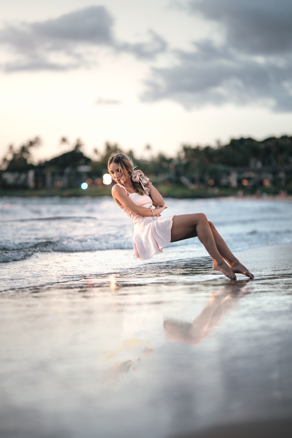 woman wearing pink mini dress on shore during daytime