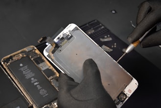 person fixing phone