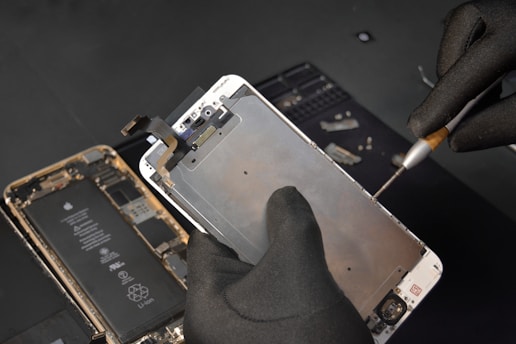 person fixing phone