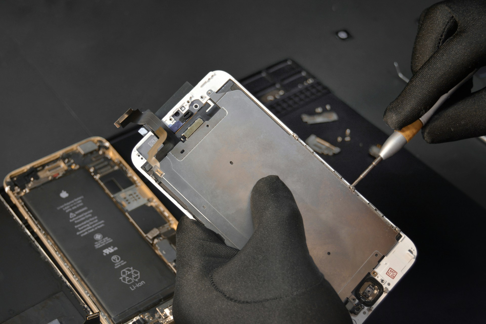 person fixing phone