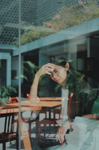 woman touching her forehead