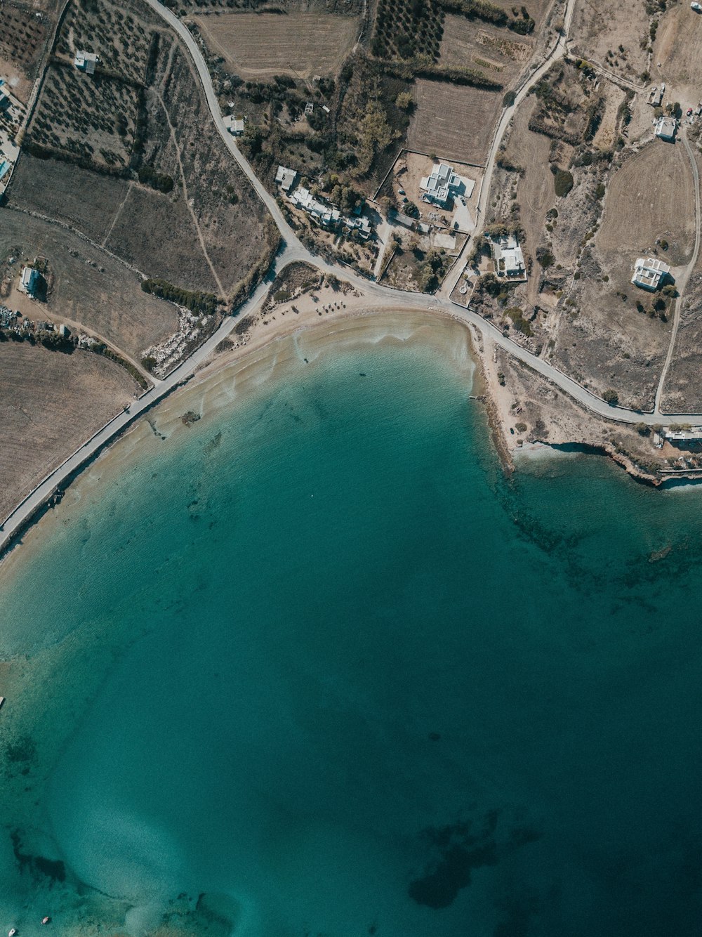 aerial photograph of body of water and landscape