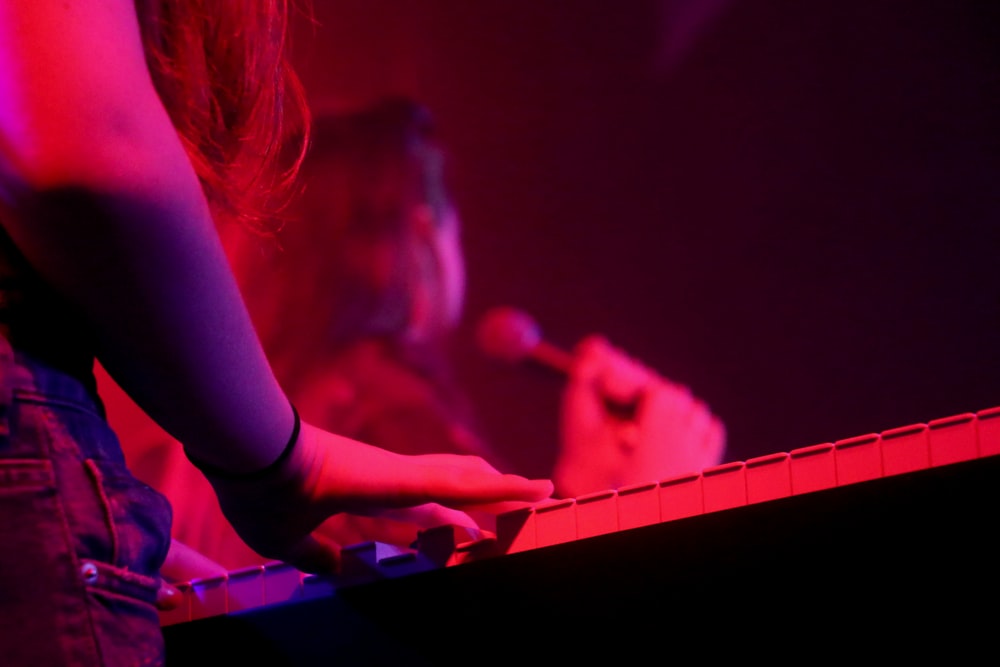 woman playing keyboard