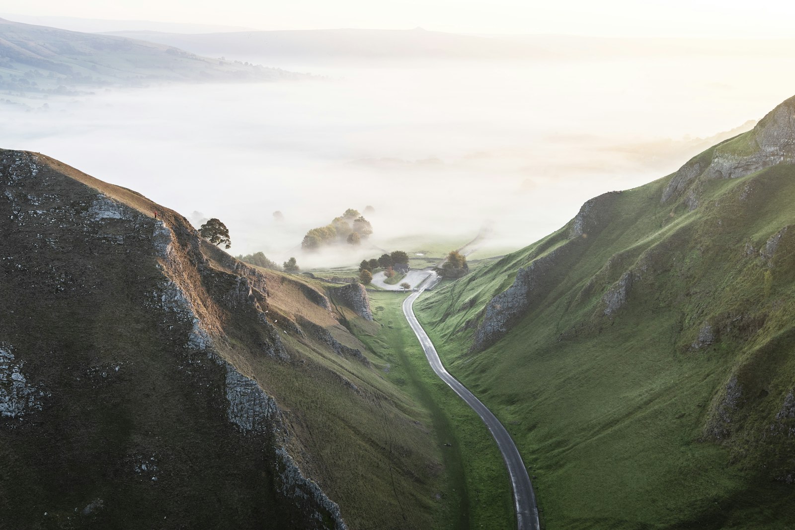 Nikon D810 + Nikon AF-S Nikkor 16-35mm F4G ED VR sample photo. Road between grassy mountains photography