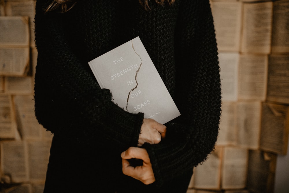 person holding book