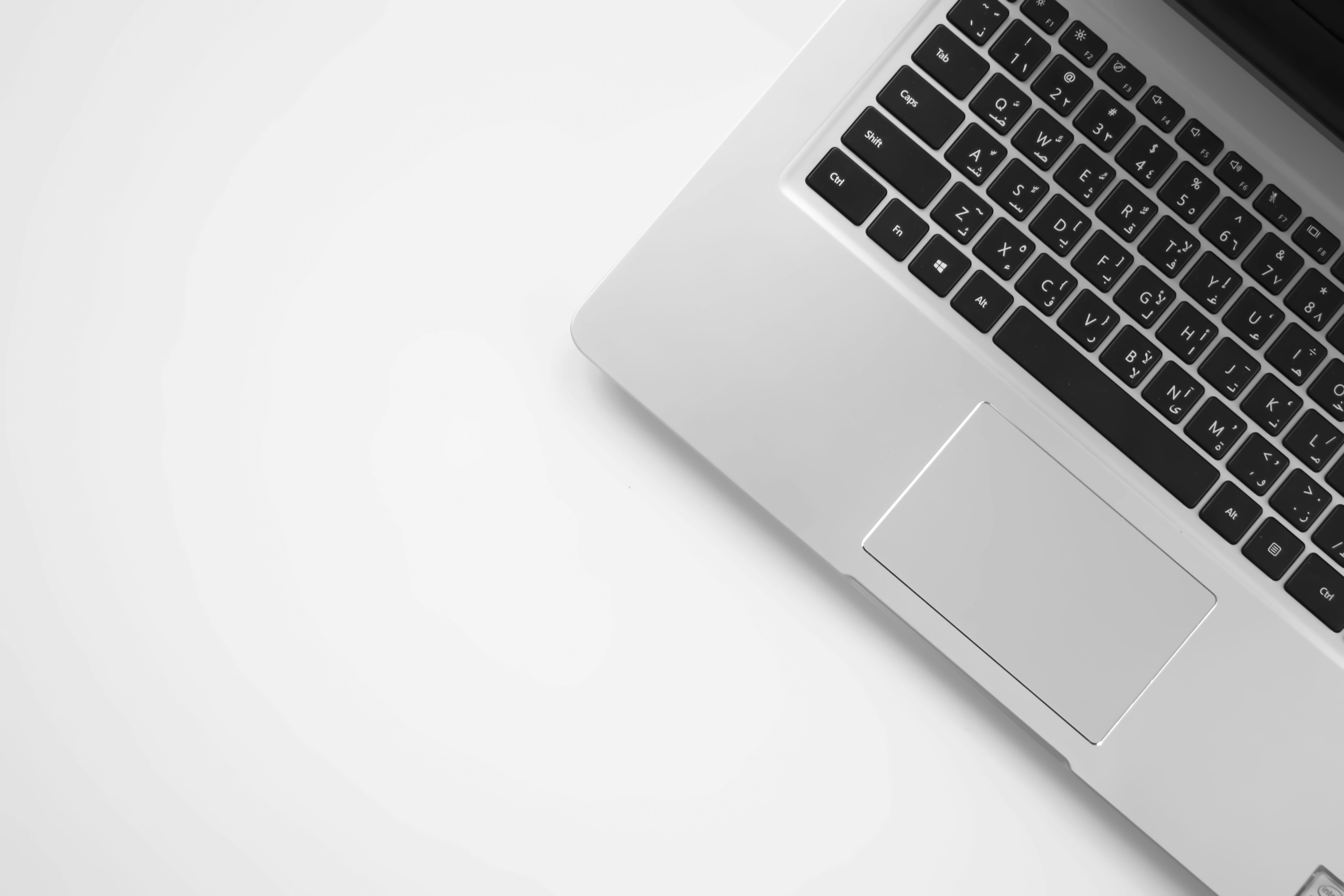 modern laptop aluminum chassis close up keyboard trackpad