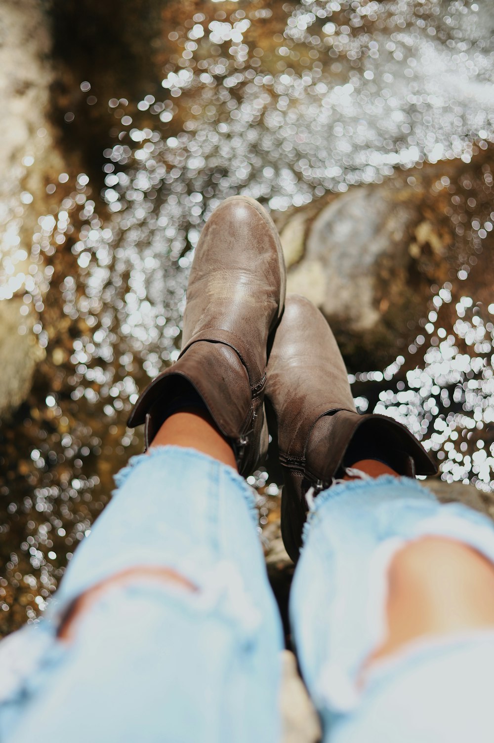 photography of person wearing boots