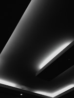 Minimalist LED recessed lights embedded seamlessly into a modern ceiling.