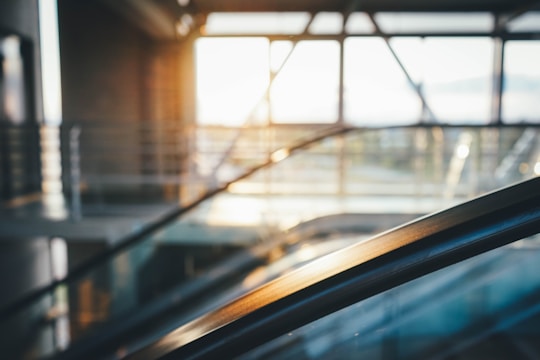 A sunlit city loft featuring slim aluminum-framed windows with clear glass.