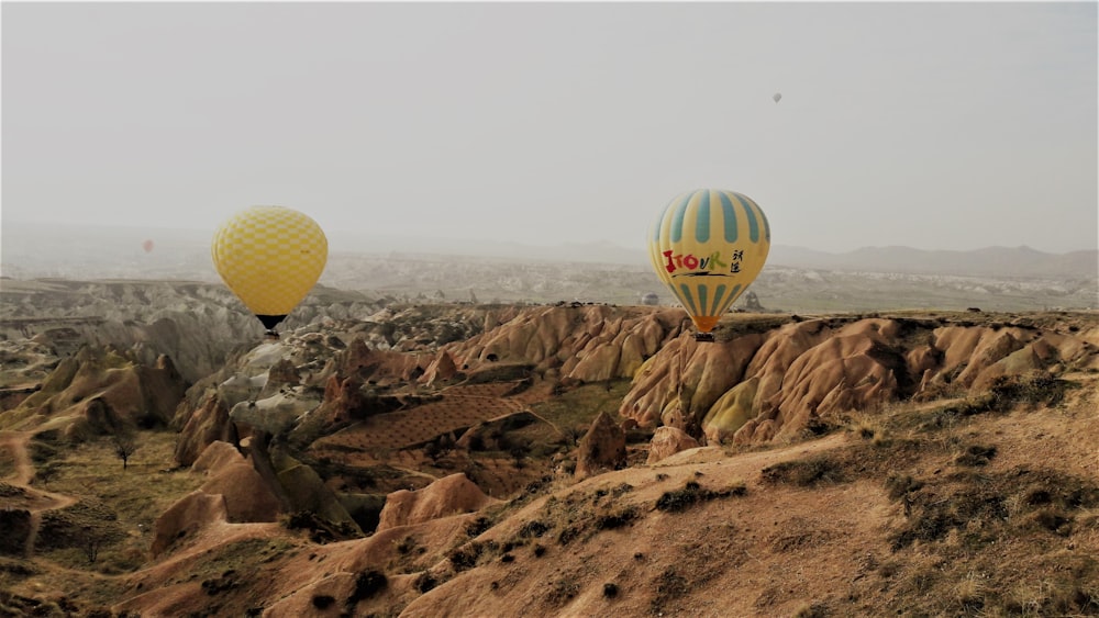 two yellow hot air balloons