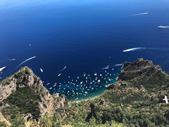 view of body of water during daytime in Blue Grotto Italy