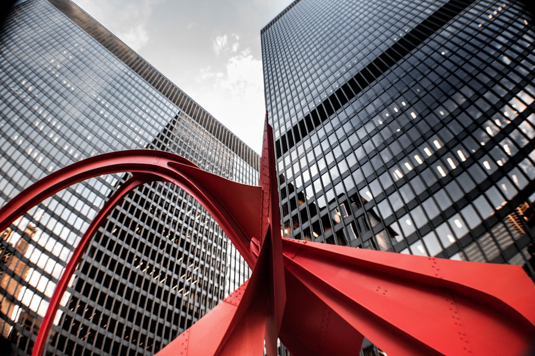 red building in front of high-rise building, The Alexander Calder Sculpture