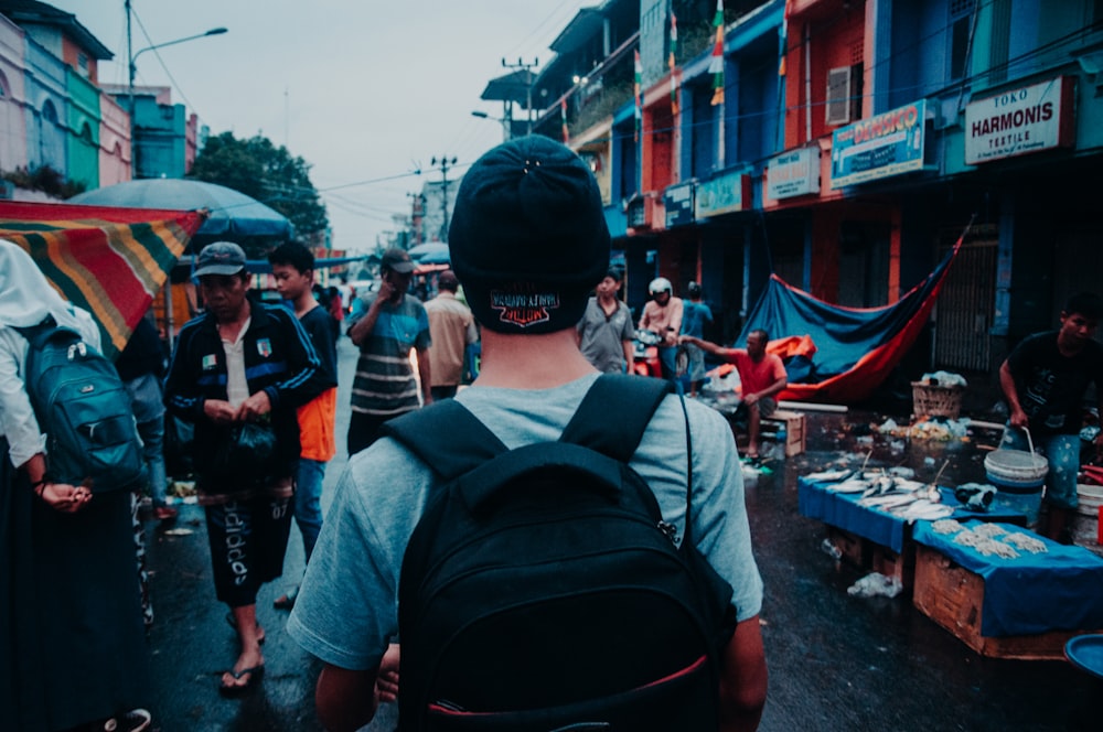 man walking on alleyway