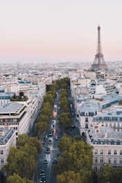 busy street near Eiffel Tower in Paris during daytime